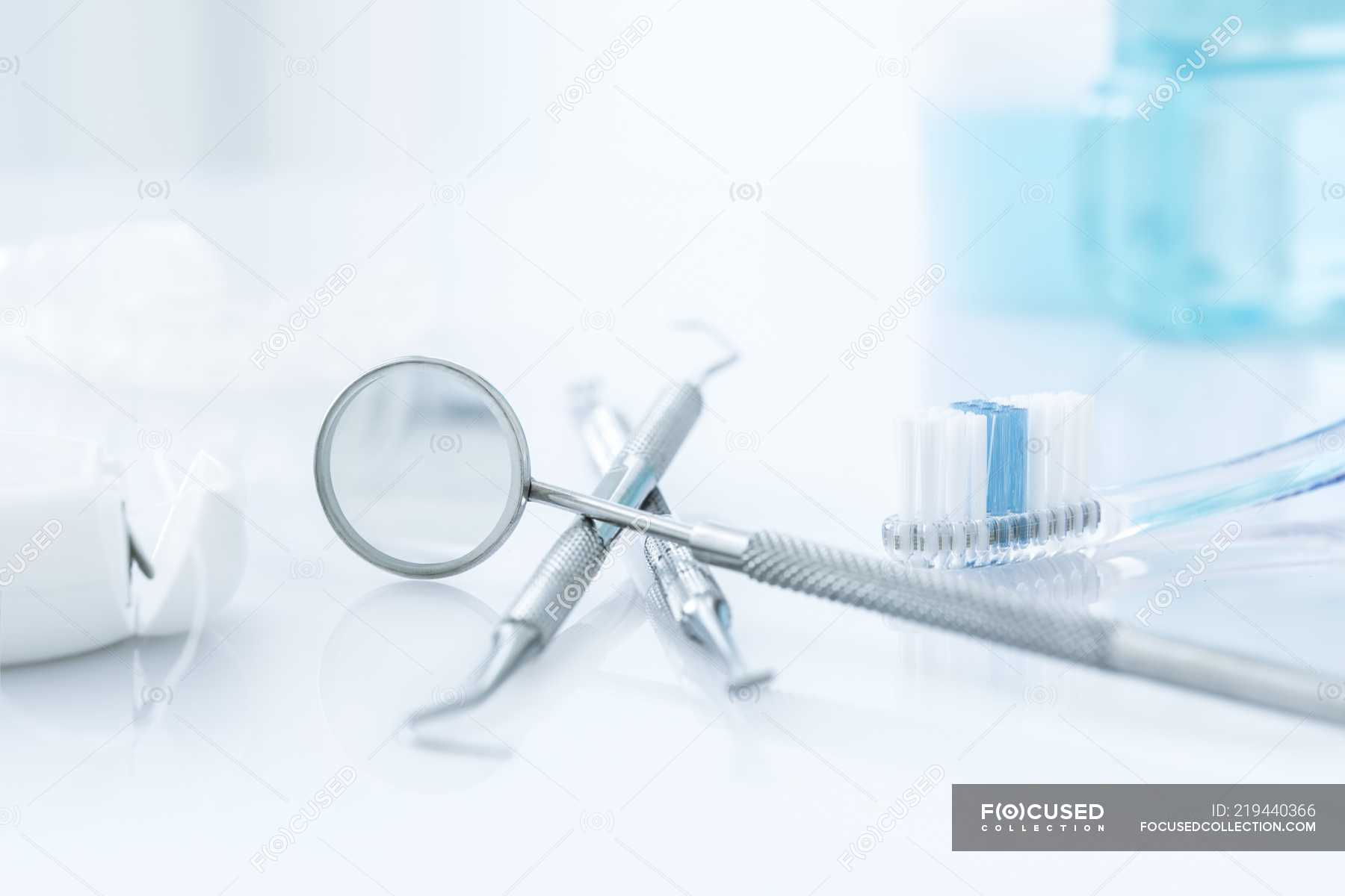 Dental clinic equipment and tools against white background. — instruments,  treatment - Stock Photo | #219440366