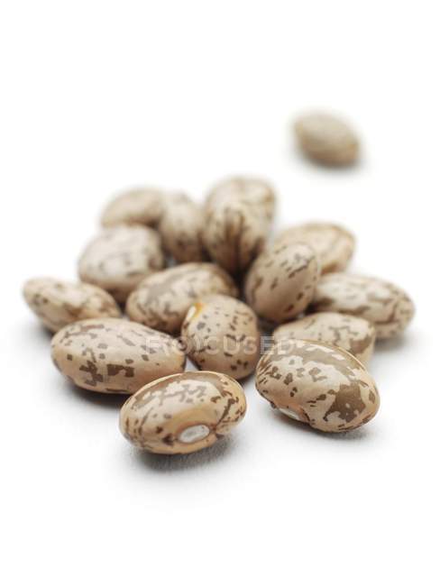 Close-up view of pinto beans on white background. — Stock Photo