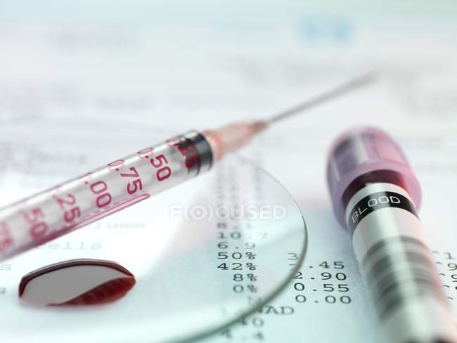 Blood test kit and and analysis results — Stock Photo