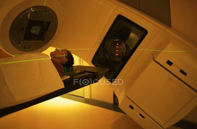 Woman undergoing radiation treatment in clinic. — Stock Photo