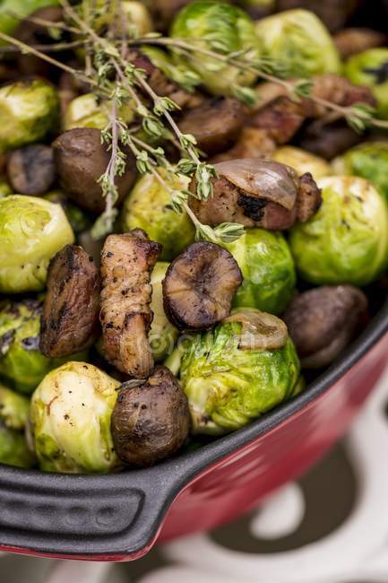 Close-up view of brussels sprouts and mushrooms dish. — Stock Photo