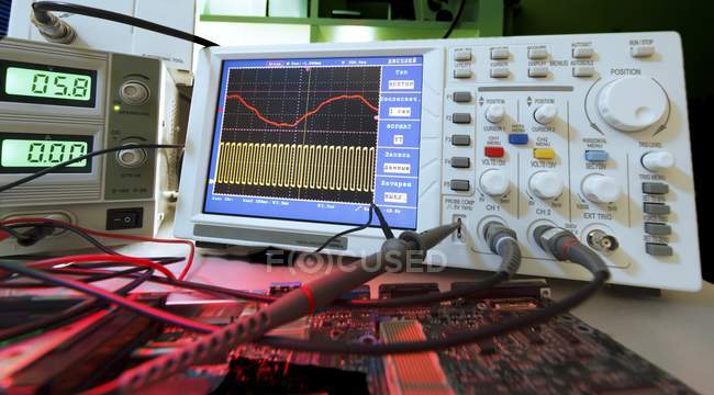 Close-up of oscilloscope screen and wires. — Stock Photo