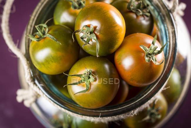 Close-up view of camone tomatoes in jar. — Stock Photo