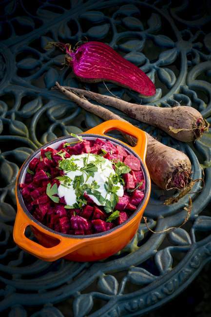 Beetroot with garnish in pan on table. — Stock Photo