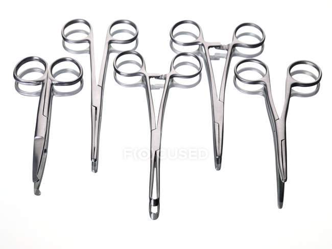 Surgical forceps on white background. — Stock Photo