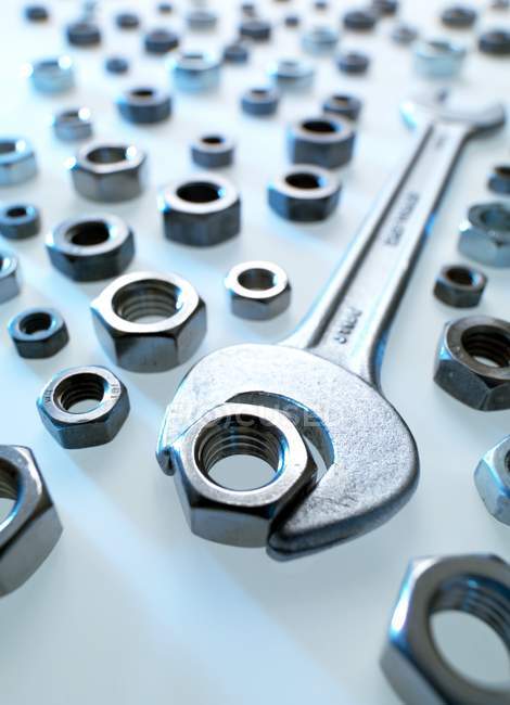 Close-up view of spanner and nuts. — Stock Photo