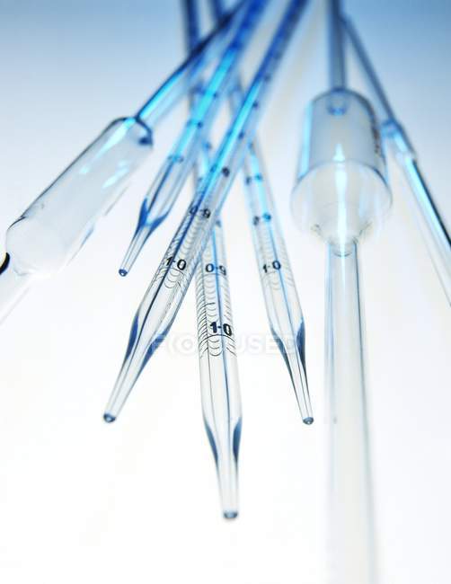 Standardized volume pipettes with bulbs, close-up. — Stock Photo