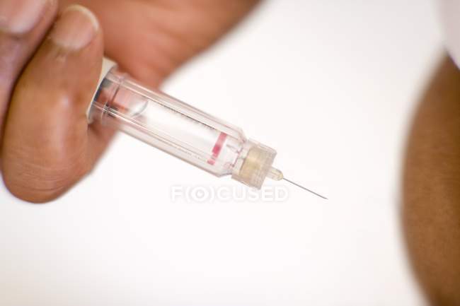 Close-up of hand making self-injection. — Stock Photo