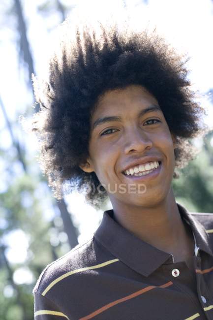 Portrait of young man with afro hairstyle. — Stock Photo