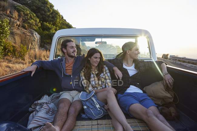 Young friends riding in pick up truck. — Stock Photo
