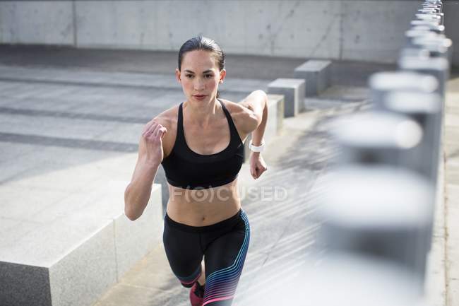 Woman running towards camera — Stock Photo