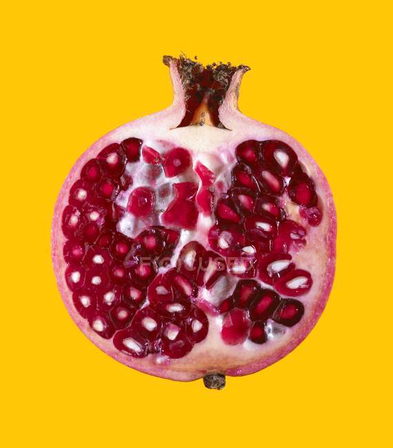 Close-up view of halved pomegranate. — Stock Photo