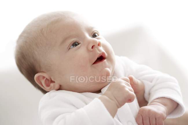 Portrait of infant baby girl looking up. — Stock Photo