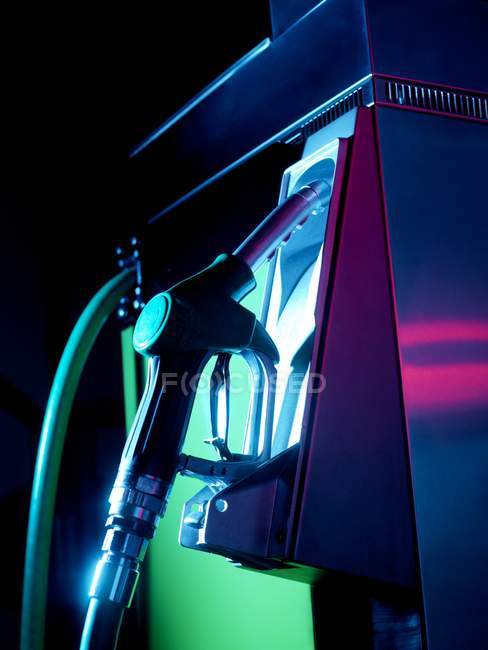 Close-up view of petrol pump illuminated at night. — Stock Photo
