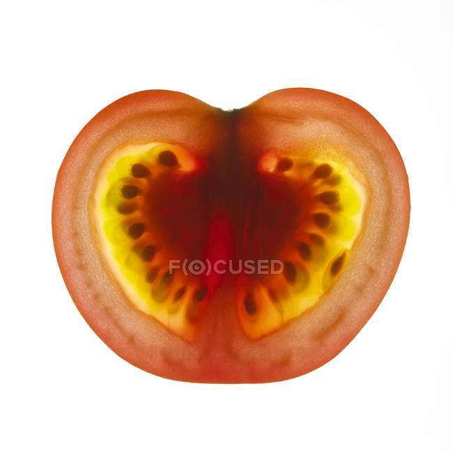 Close-up view of tomato slice on white background. — Stock Photo