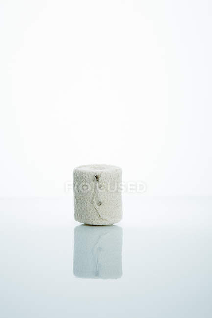 Bandage rolled with safety pin. — Stock Photo