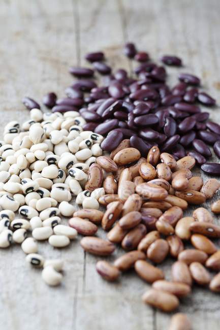 Kidney beans on wooden table — Stock Photo