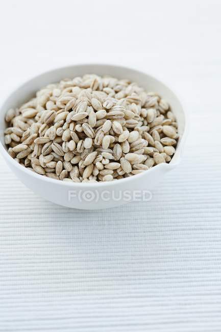 Pearl barley in small bowl — Stock Photo