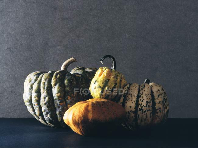 Pile of pumpkins on table — Stock Photo