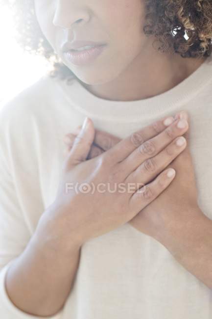 Woman touching chest. — Stock Photo