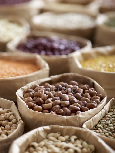 Close-up view of legumes in paper bags. — Stock Photo
