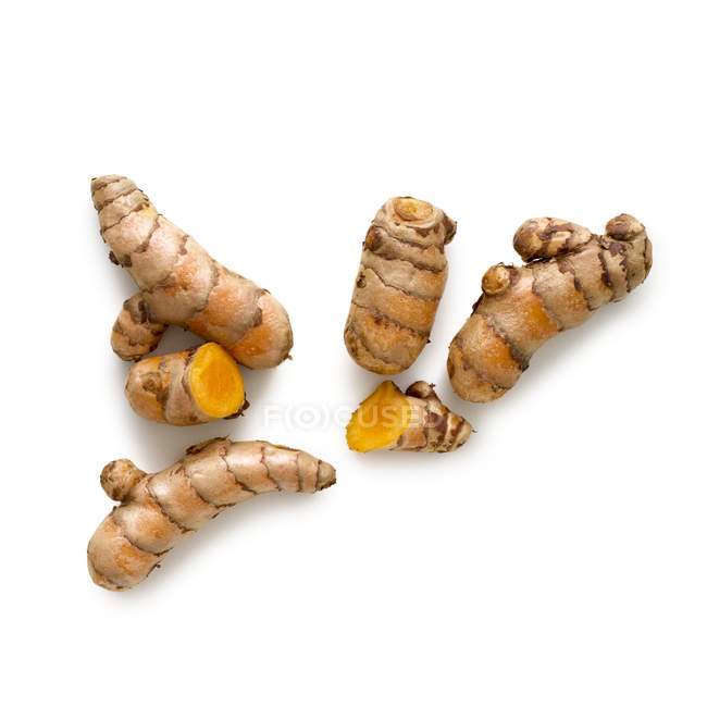 Turmeric roots on white background. — Stock Photo