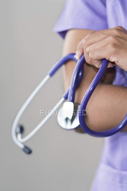 Female doctor holding stethoscope. — Stock Photo