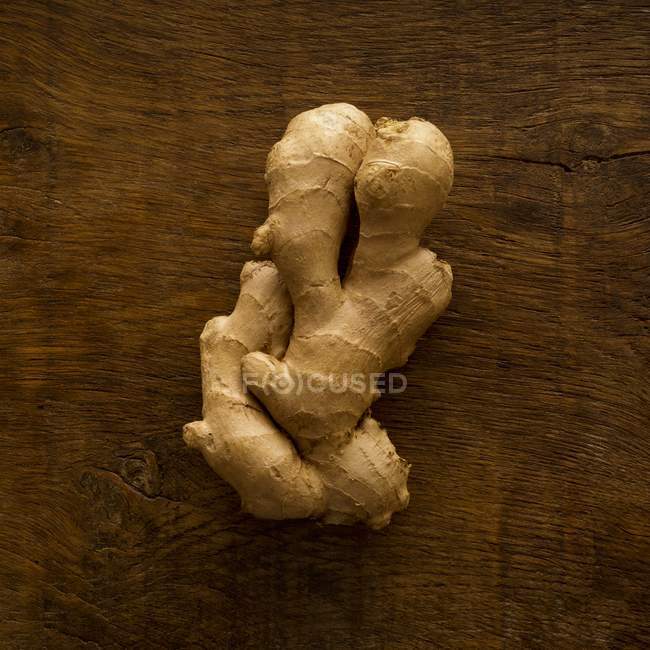 Ginger root on wooden table, studio shot. — Stock Photo