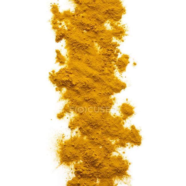Turmeric powder on white background. — Stock Photo