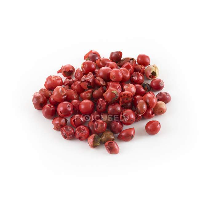 Red peppercorns on white background. — Stock Photo