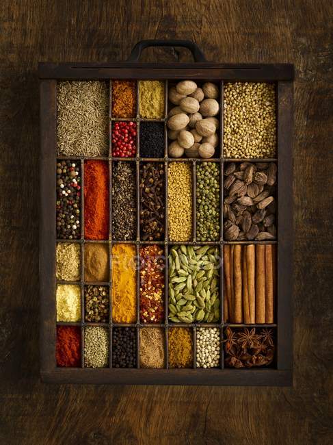 Selection of dried spices in drawer. — Stock Photo