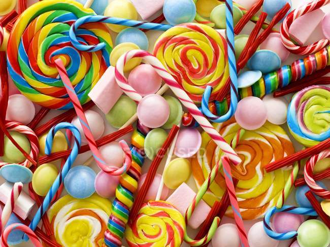 Colorful sweets and candy canes, full frame. — Stock Photo