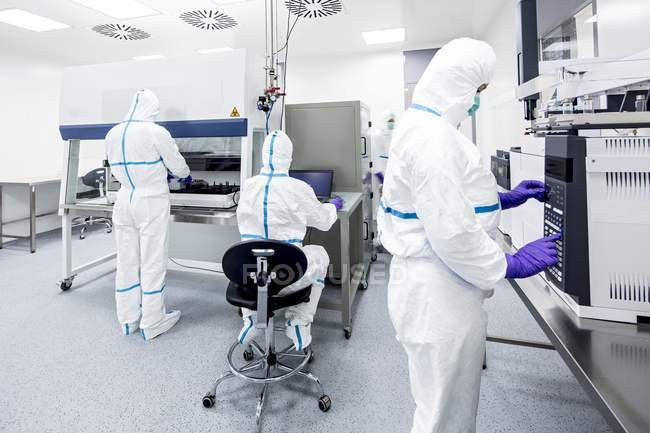 Technicians preparing and checking samples in manufacturing bioengineering laboratory. — Stock Photo