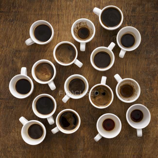 Cups of black aromatic coffee, top view. — Stock Photo