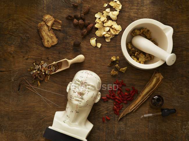 Herbs and equipment for alternative medicine on wooden background. — Stock Photo