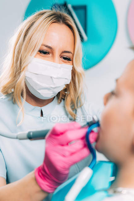 Female orthodontist working with little boy. — Stock Photo