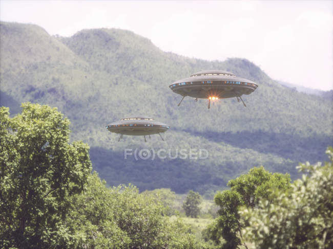UFOs flying above forest trees, illustration. — Stock Photo