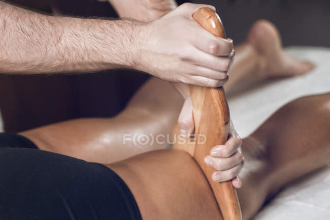 Close-up of woman having anti-cellulite maderotherapy. — Stock Photo