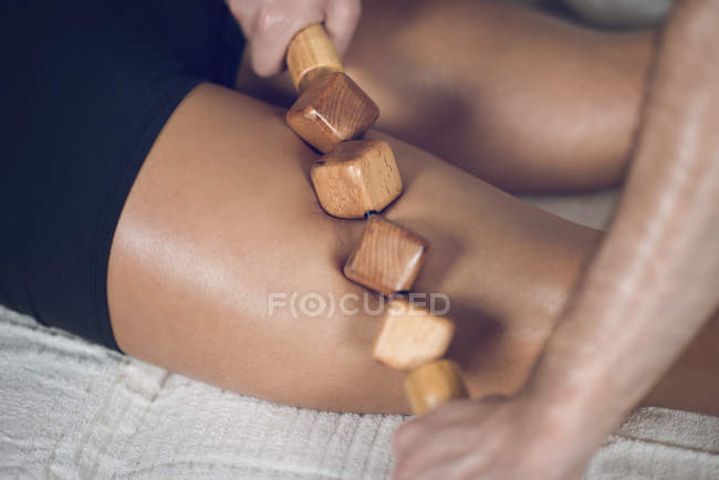 Close-up of woman having anti-cellulite maderotherapy. — Stock Photo