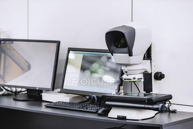 Combined video measuring system and ergonomic measuring microscope for devices in modern industrial facility. — Stock Photo