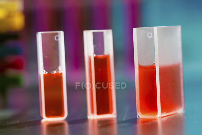 Liquid samples in quartz cuvettes containers. — Stock Photo