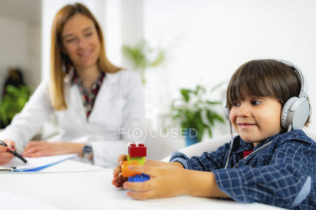 Boy having hearing test in female audiologist office. — Stock Photo
