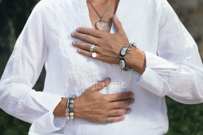 Midsection of woman expressing gratitude with hands. — Stock Photo