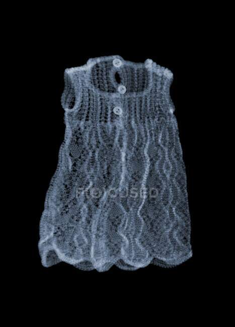Doll knitted dress, coloured X-ray. — Stock Photo