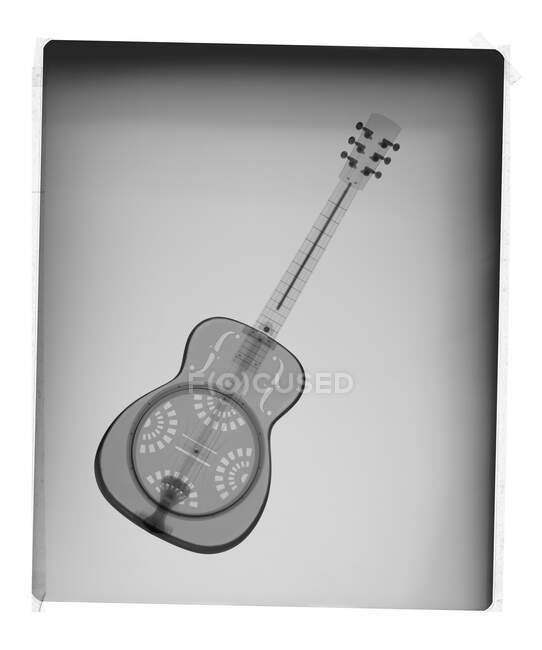 Acoustic guitar on film, X-ray. — Stock Photo