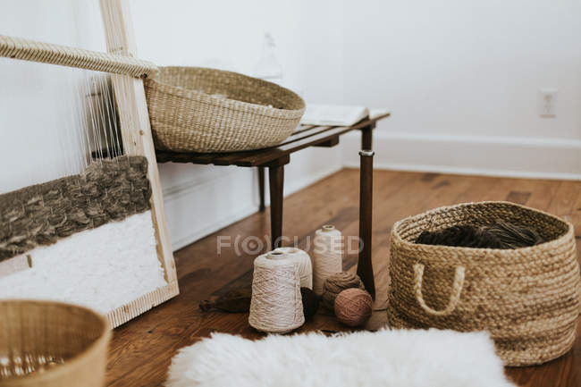 Knitting yarn balls and knitting machine — Stock Photo