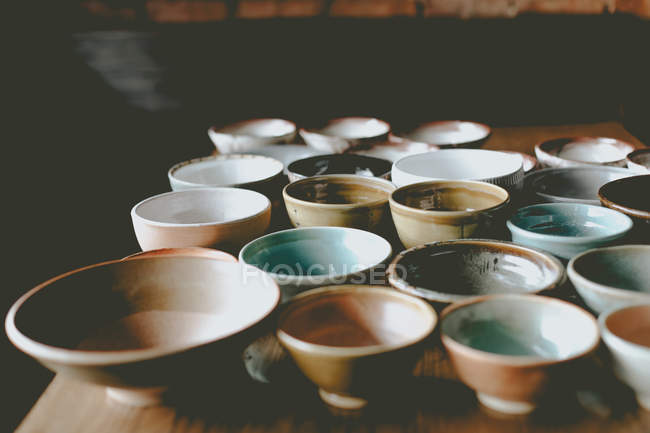 Empty colorful ceramic bowls — Stock Photo