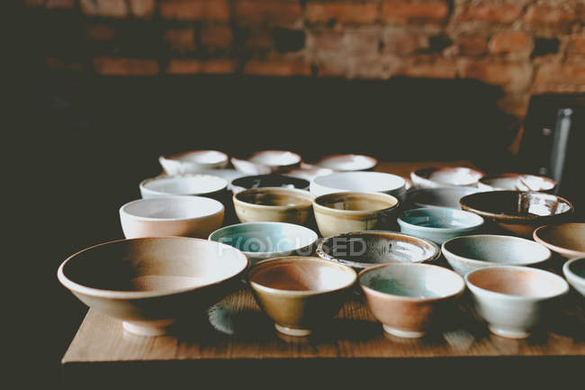 Empty colorful ceramic bowls — Stock Photo