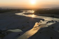 Piave river lit by evening sun — Stock Photo