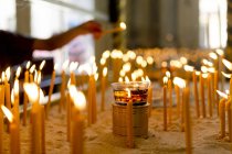 Man Lighting candles — Stock Photo